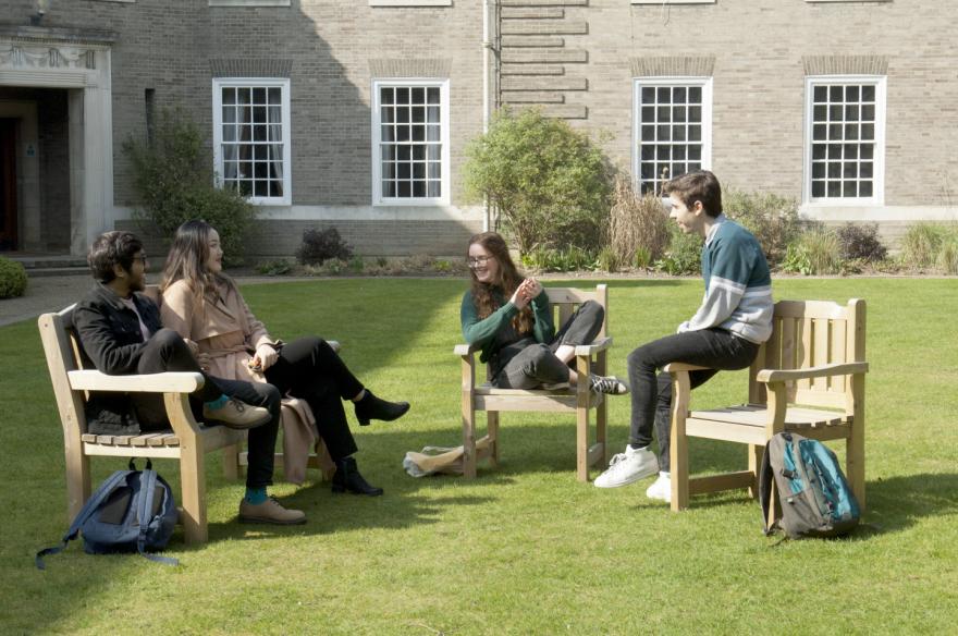 Students sitting in Memorial Court